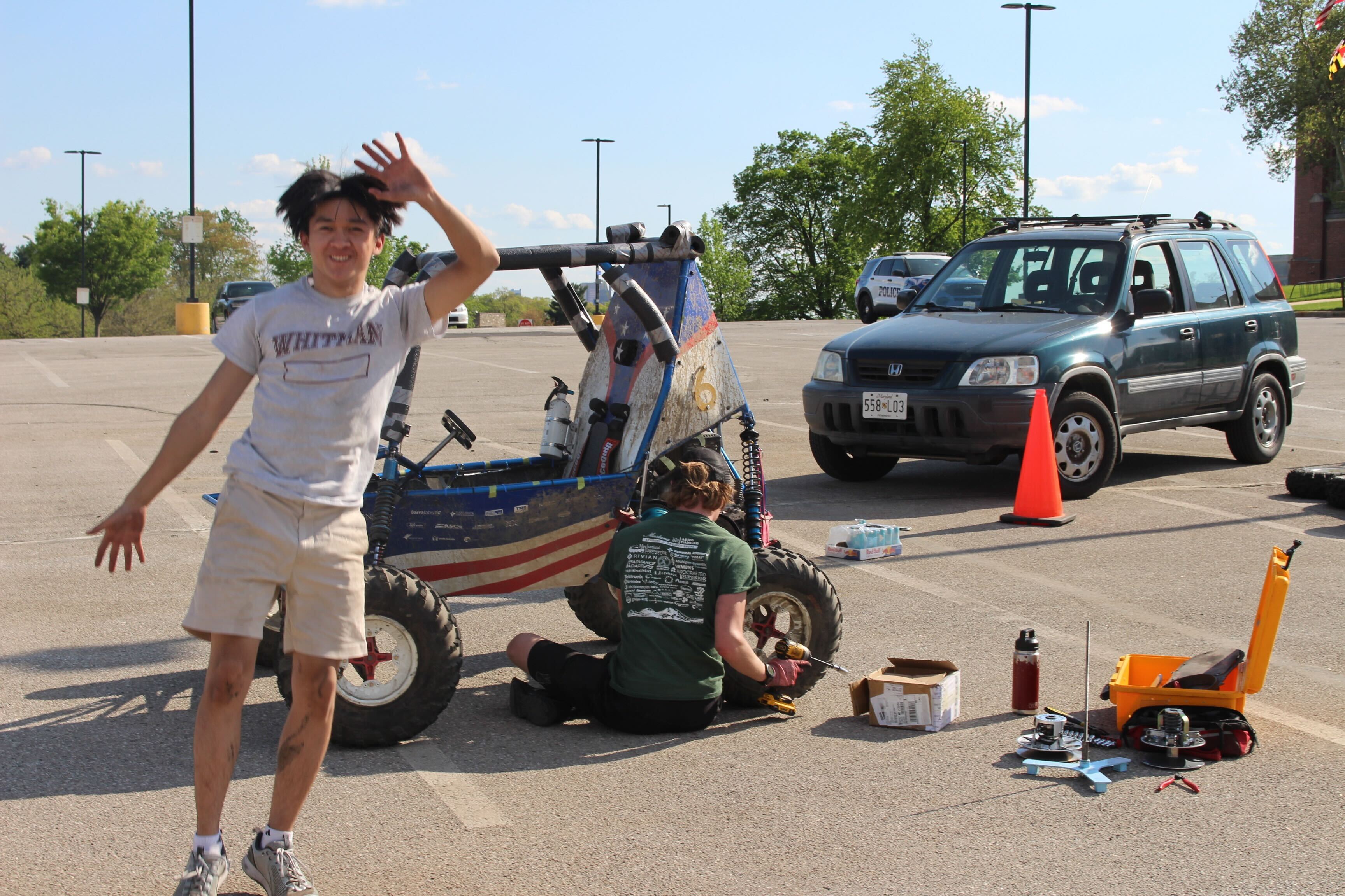 William Tun with a Baja SAE vehicle